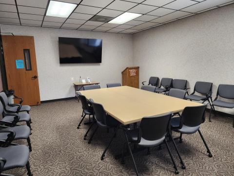 Pioneer Room II set up with table and chairs.