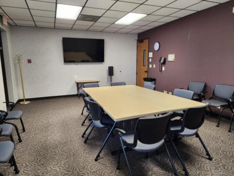 Pioneer Room I set up with table and chairs.